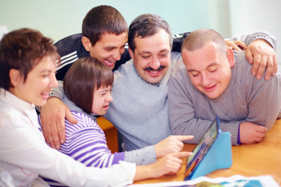 happy people having fun using the tablet